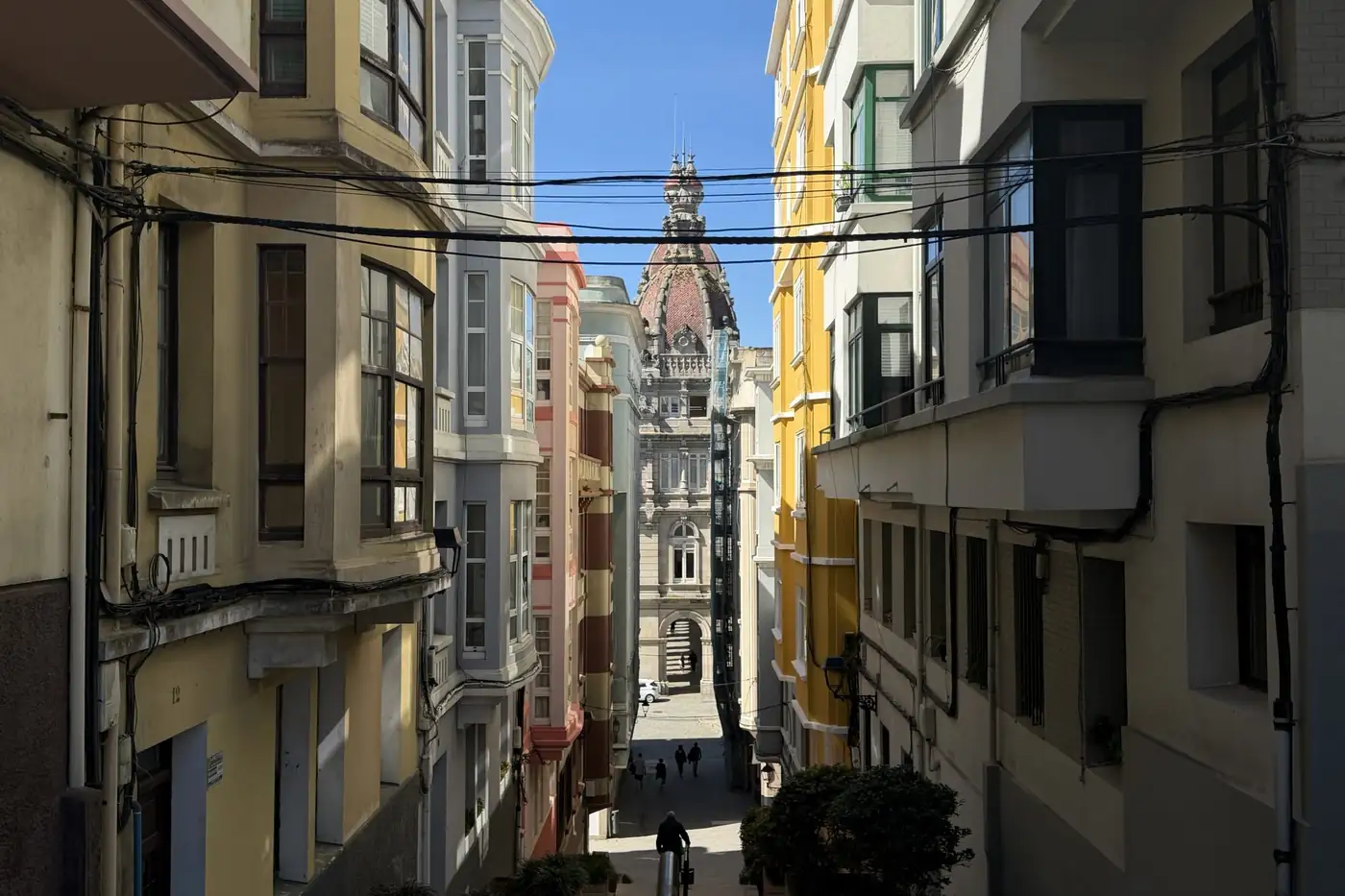 Narrow street of tall buildings with bay windows
